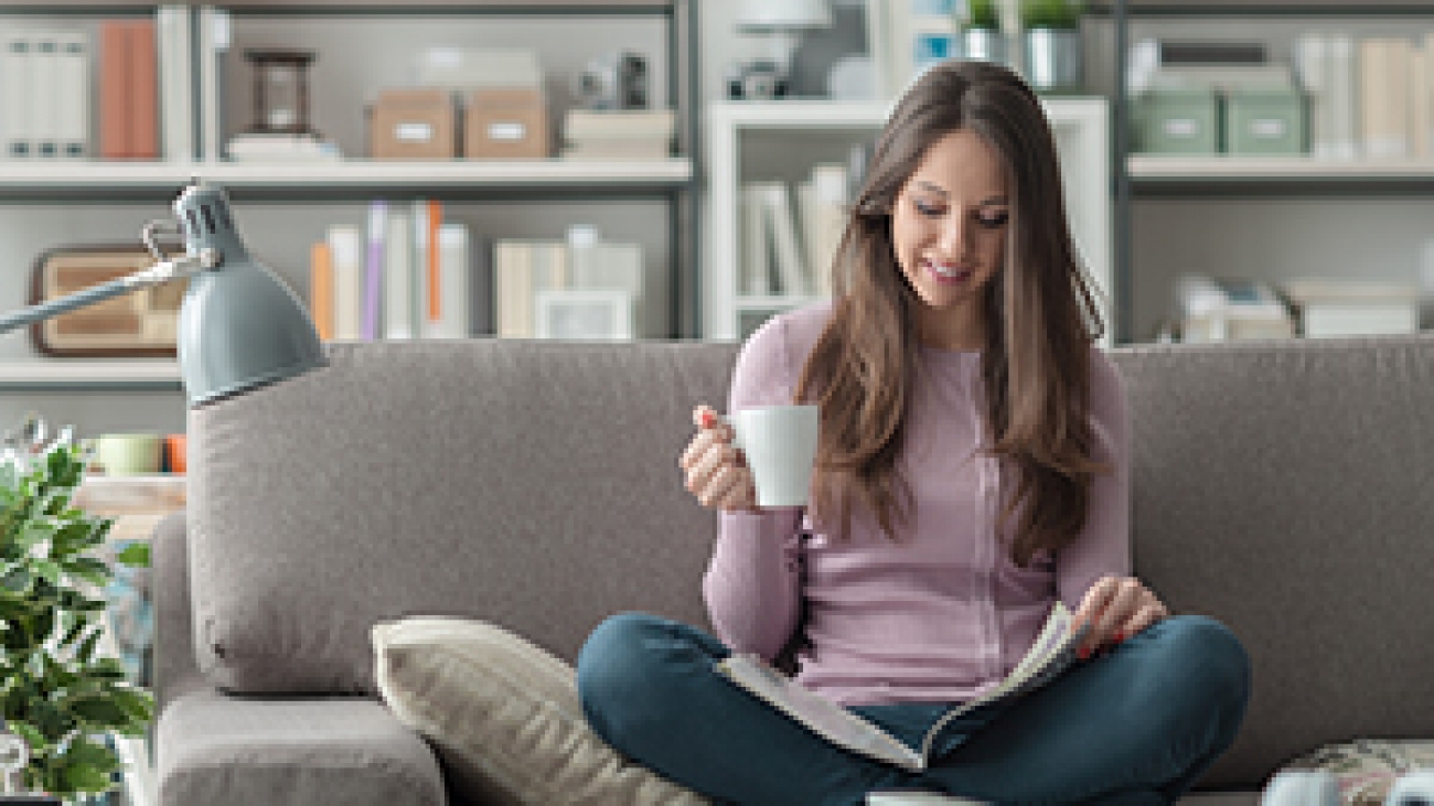 Woman reading magazine.