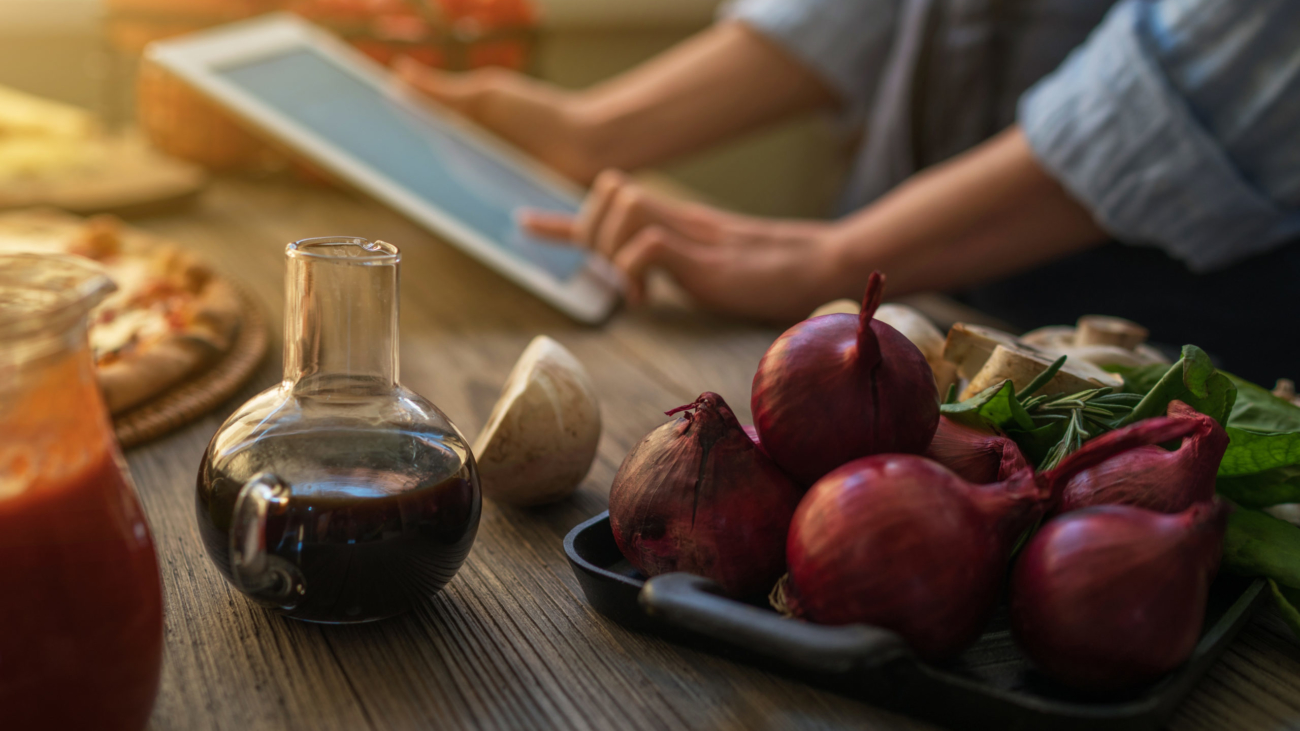 The,Young,Woman,Looking,Recipe,In,A,Tablet,Computer,In